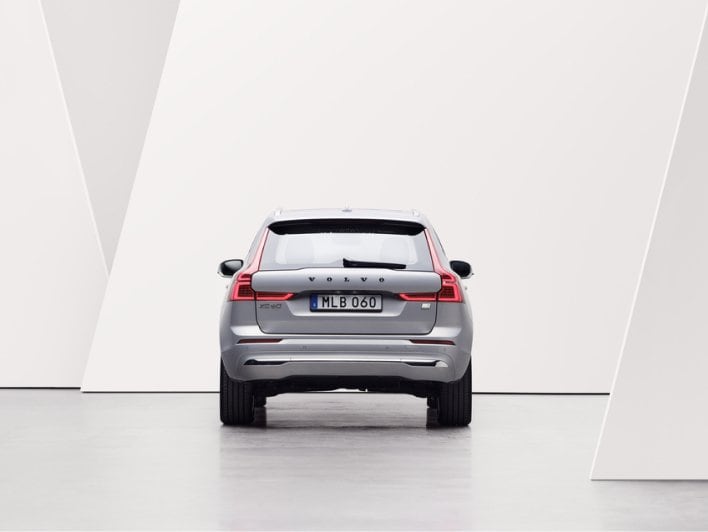 Image of XC60 in white/grey studio environment. The image is showing the rear of the car.