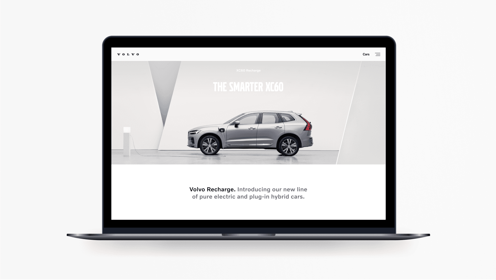 Example title set in Volvo Broad. This heading is positioned top, centre in the context of a Volvo Cars web page. This screen is presented on a laptop. Heading reads: 'The Smarter XC60.'